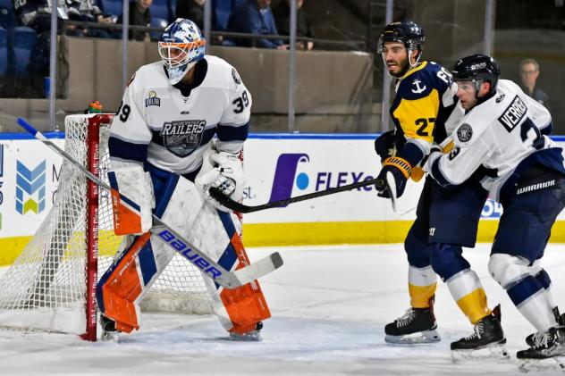 Worcester Railers' Henrik Tikkanen and Ryan Verrier and Norfolk Admirals' Ryan Foss in action