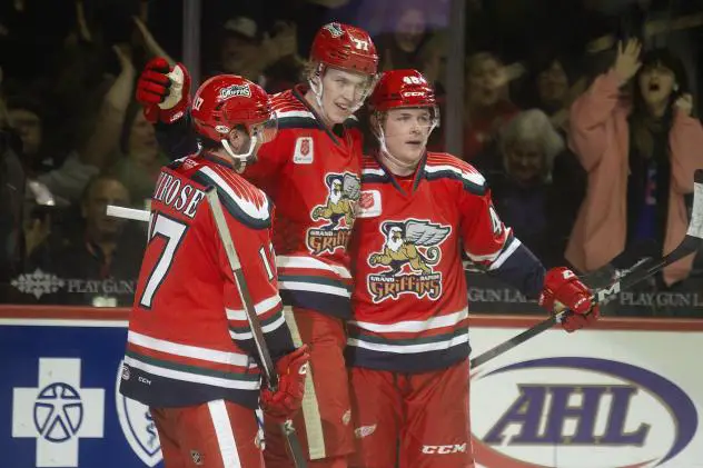 Grand Rapids Griffins' Taro Hirose, Simon Edvinsson, and Jonatan Berggren celebrate win