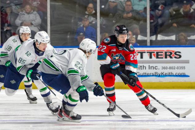 Seattle Thunderbirds' Sam Popowich, Luca Hauf, and Simon Lovsin versus Kelowna Rockets' Gabriel Szturc