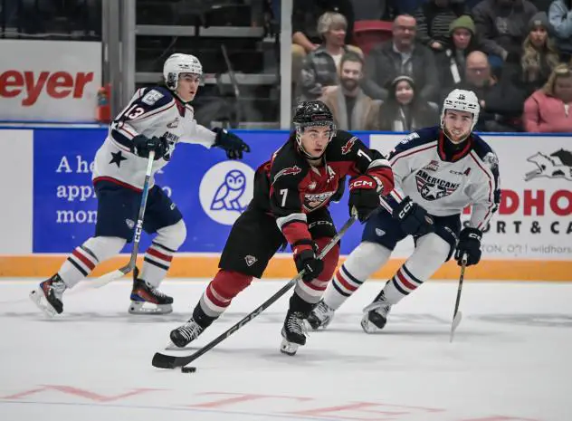 Vancouver Giants' Ty Halaburda and Tri-City Americans' Jordan Gavin and Jake Sloan on the ice