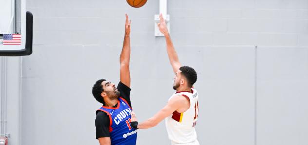 Cleveland Charge's Pete Nance and Motor City Cruise's Jontay Porter in action