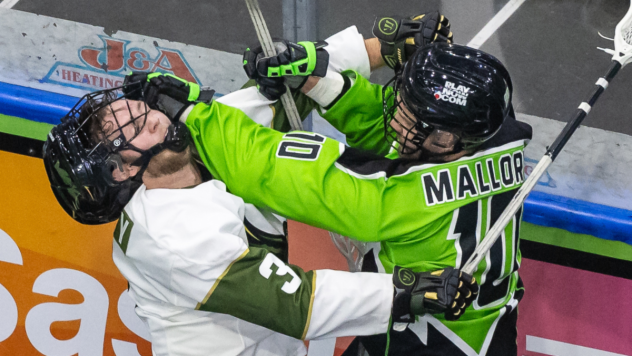 Rochester Knighthawks' Thomas Whitty battles Saskatchewan Rush's Mike Mallory