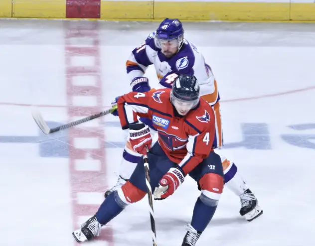 Orlando Solar Bears' Alexandre Fortin and South Carolina Stingrays' Nick Leivermann on the ice