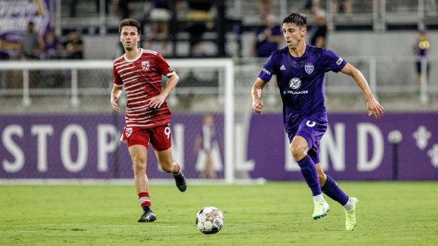 Louisville City FC defender Wes Charpie (right)