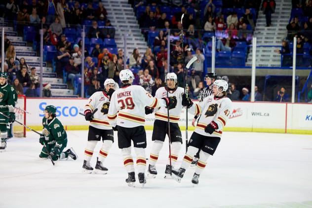 Vancouver Giants captain Sam Honzek celebrates with teammates