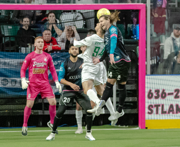St. Louis Ambush forward William Eskay (right) heads the ball vs. the Dallas Sidekicks