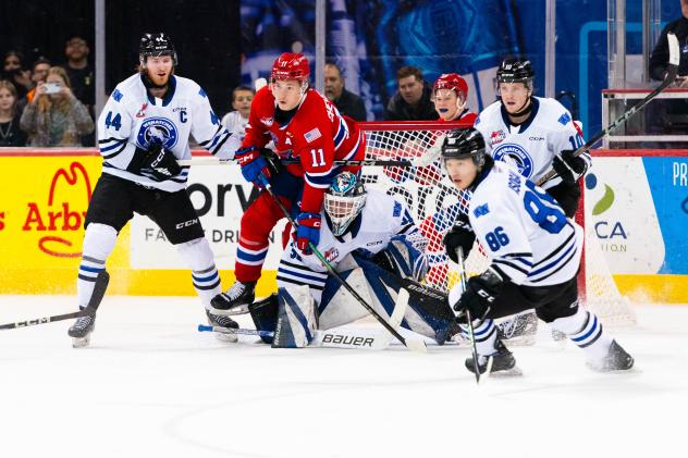 Wenatchee Wild's Dawson Seitz, Daniel Hauser, Kenta Isogai, and Evan Friesen and Spokane Chiefs' Ty Cheveldayoff on game night