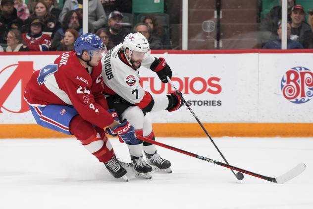 Laval Rocket's Logan Mailloux battles Belleville Senators' Jarid Lukosevicius