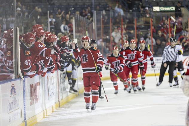 Rapid City Rush's T.J. Fergus congratulated by team