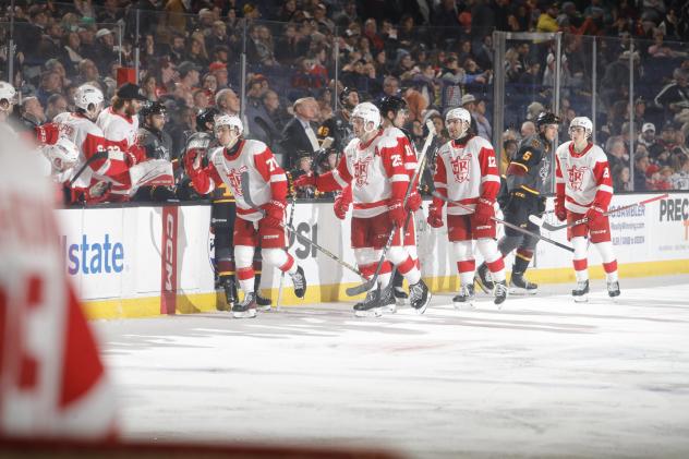 Grand Rapids Griffins' Cross Hanas, Brogan Rafferty, and Zach Aston-Reese congratulated by team