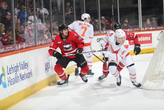 Charlotte Checkers' Mark Senden and Lehigh Valley Phantoms' Louie Belpedio and Emil Andrae on the ice