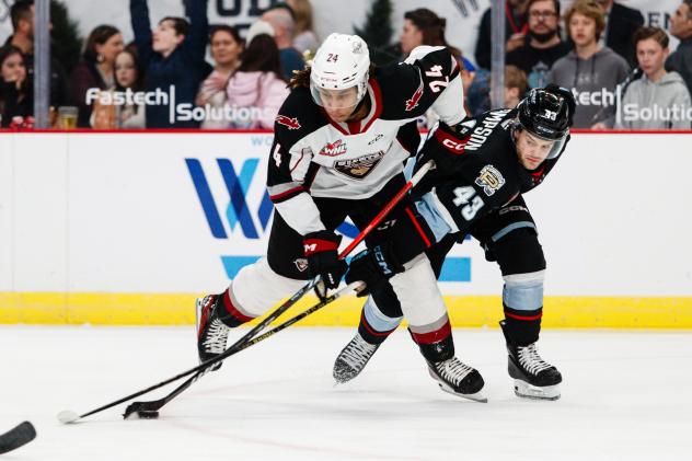 Vancouver Giants' London Hoilett battles Portland Winterhawks' Ryder Thompson