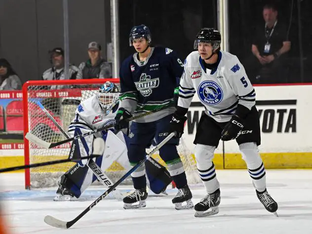 Wenatchee Wild defenseman Ashton Cumby (right)