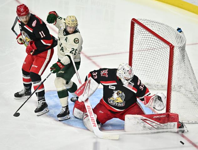 Grand Rapids Griffins' 	Joel L'Esperance and Sebastian Cossa battle Iowa Wild's Samuel Walker