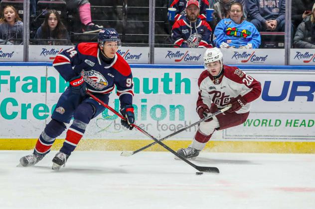 Saginaw Spirit's Rodwin Dionicio and Peterborough Petes' Tommy Purdeller on game night