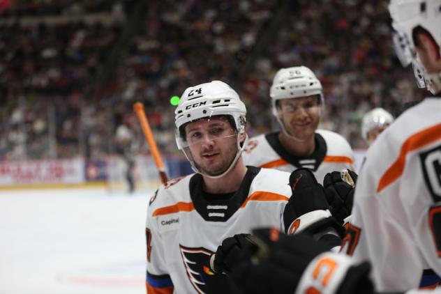 Lehigh Valley Phantoms exchange fist bumps along the bench