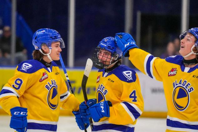 Saskatoon Blades' Rhett Melnyk and Brayden Klimpke on game night