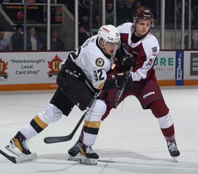 Kingston Frontenacs' Matthew Soto battles Peterborough Petes' Caden Taylor
