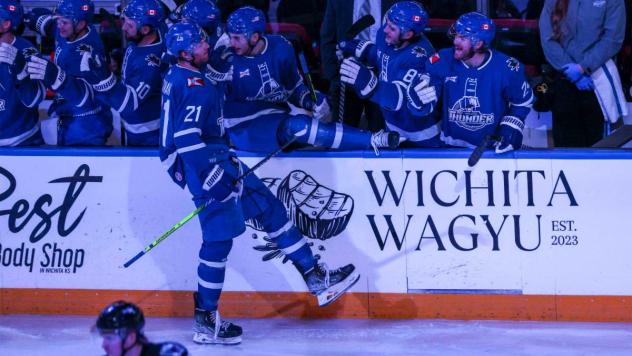 Wichita Thunder forward Jay Dickman along the team bench