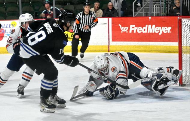 Wenatchee Wild's Hayden Moore battles Kamloops Blazers' Dylan Ernst