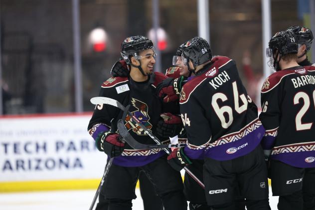 Tucson Roadrunners' Montana Onyebuchi, Max Szuber, and Patrik Koch on game night