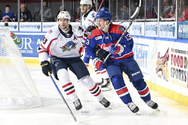 Springfield Thunderbirds defenseman Calle Rosen (left) vs. the Rochester Americans
