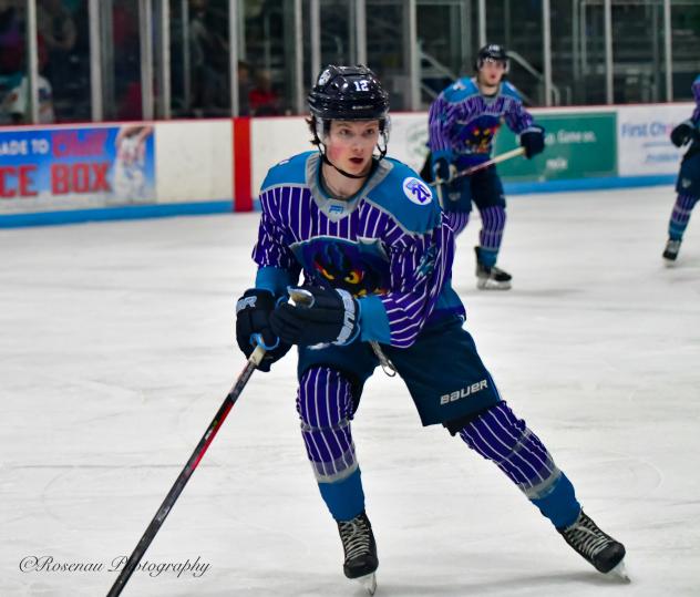 Madison Capitols forward Quinn Finley wears a Madison Monsters jersey