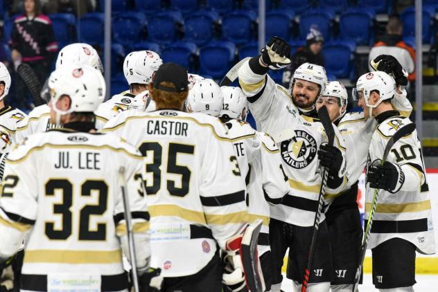 Wheeling Nailers exchange congratulations after an overtime victory