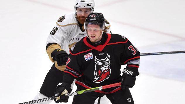 Adirondack Thunder's Erik Middendorf and Newfoundland Growlers' Todd Skirving on game night