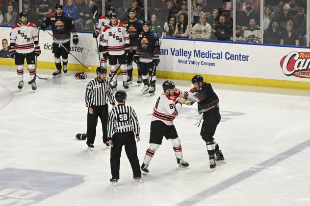 Rapid City Rush's Jarrod Gourley and Utah Grizzlies' Josh Wesley drop gloves