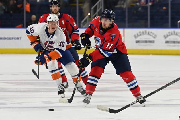 Bridgeport Islanders' Kyle MacLean and Springfield Thunderbirds' Hugh McGing in action
