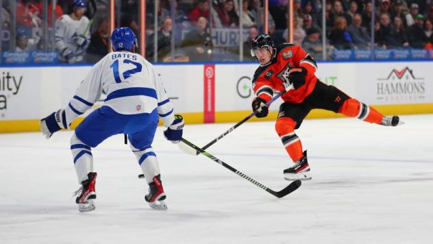 Wichita Thunder forward Peter Bates (left) vs. the Kansas City Mavericks
