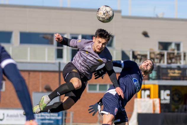 Danny Griffin of the Pittsburgh Riverhounds heads the ball