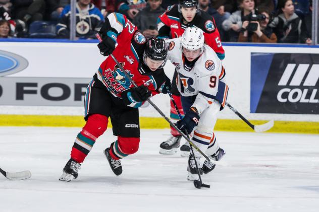 Kelowna Rockets centre Gabriel Szturc (left)