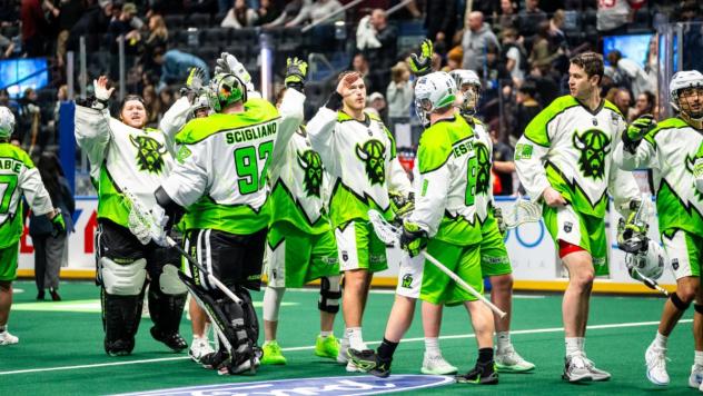 Saskatchewan Rush exchange high fives following a win