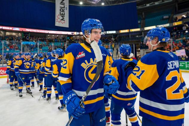 Saskatoon Blades exchange congratulations after a win