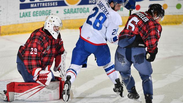 Adirondack Thunder's Vinnie Purpura and Ryan Wheeler and the Trois-Rivieres Lions' Parker Saretsky in action