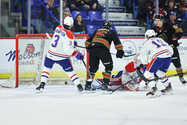 Vancouver Giants defenseman Logen Hammett (center) scores against the Spokane Chiefs