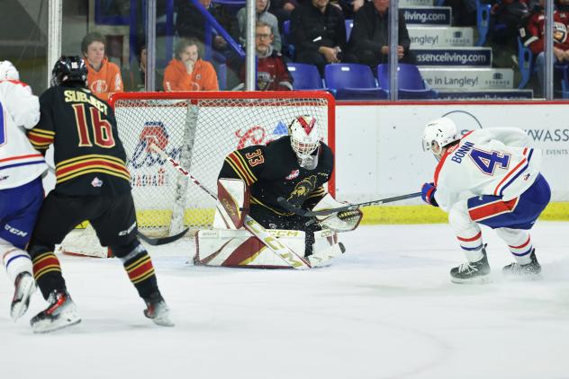 Vancouver Giants goaltender Brett Mirwald stops a shot against the Spokane Chiefs