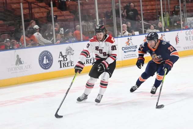 Rapid City Rush's Blake Bennett and Greenville Swamp Rabbits'Ethan Cap in action