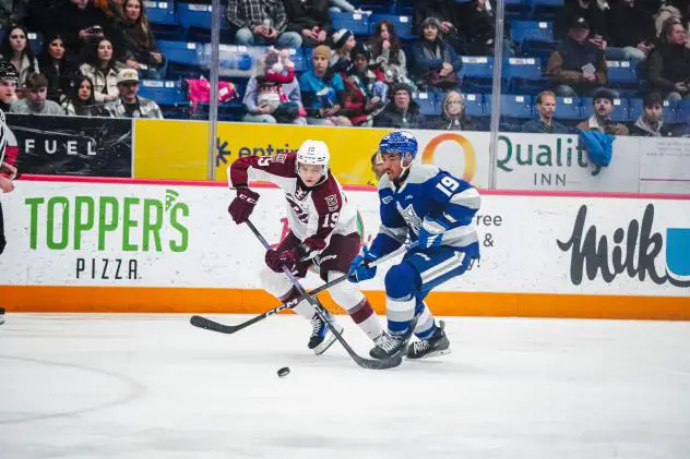 Peterborough Petes' Caden Taylor and Sudbury Wolves' Donovan McCoy in action