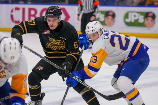 Brandon Wheat Kings' Matthew Henry and Saskatoon Blades' Rowan Calvert in action