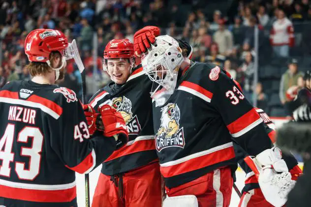 Grand Rapids Griffins' Sebastian Cossa and Carter Mazur celebrate win