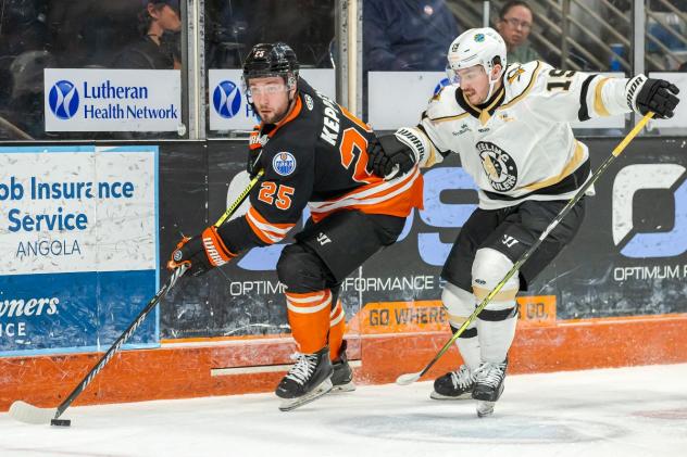 Fort Wayne Komets' Ethan Keppen and  Wheeling Nailers' Felix Pare in action