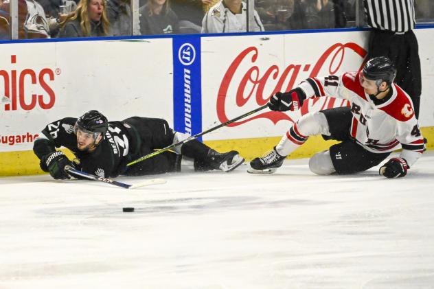 Utah Grizzlies' Alex Beaucage battles Rapid City Rush's Peter Muzyka