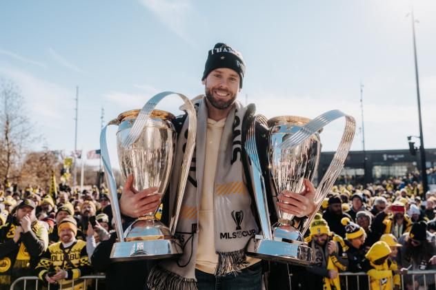 Josh Williams holds the MLS Cups won by the Columbus Crew