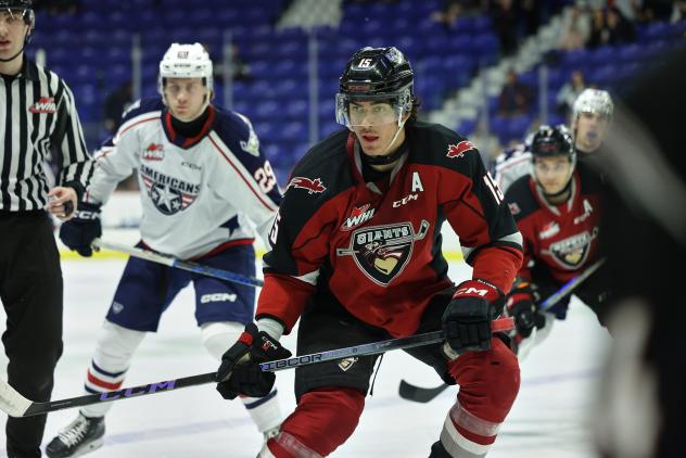 Tri-City Americans' Carter MacAdams and Vancouver Giants' Jaden Lipinski on the ice
