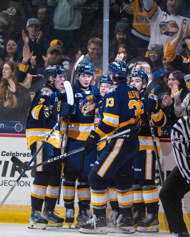 Erie Otters react celebrate a goal