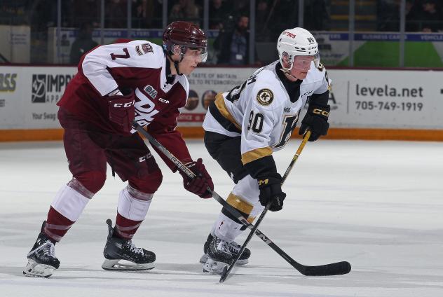 Peterborough Petes centre Chase Lefebvre (left) vs. the Kingston Frontenacs