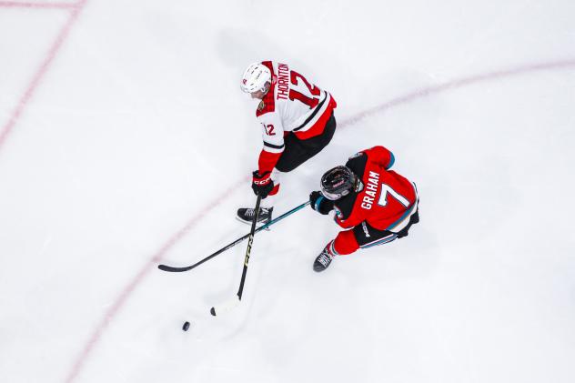 Prince George Cougars' Hudson Thornton versus Kelowna Rockets' Max Graham